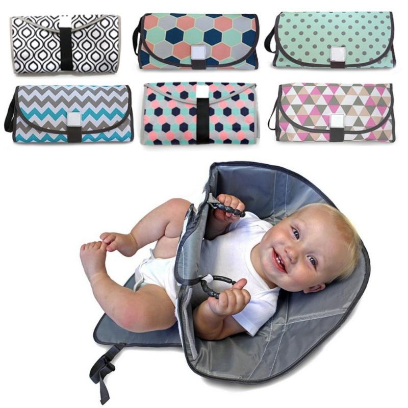 Secondary view of diaper bag in grey for travel use baby learning toy